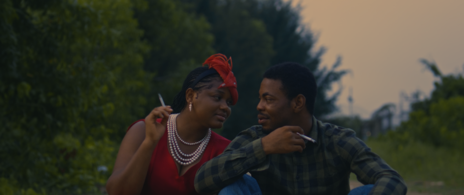 A young couple share a quiet moment at dusk
